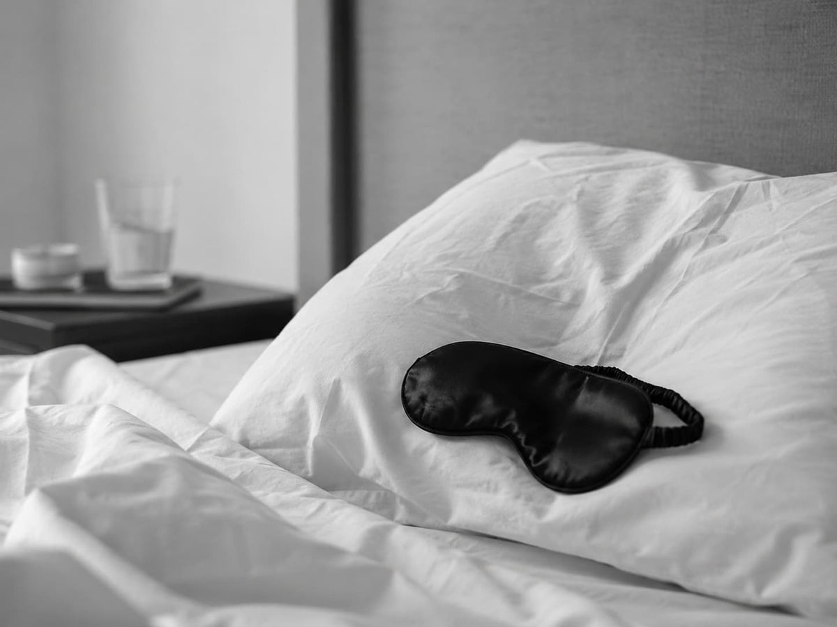 Person in bed representing disrupted sleep after drinking
